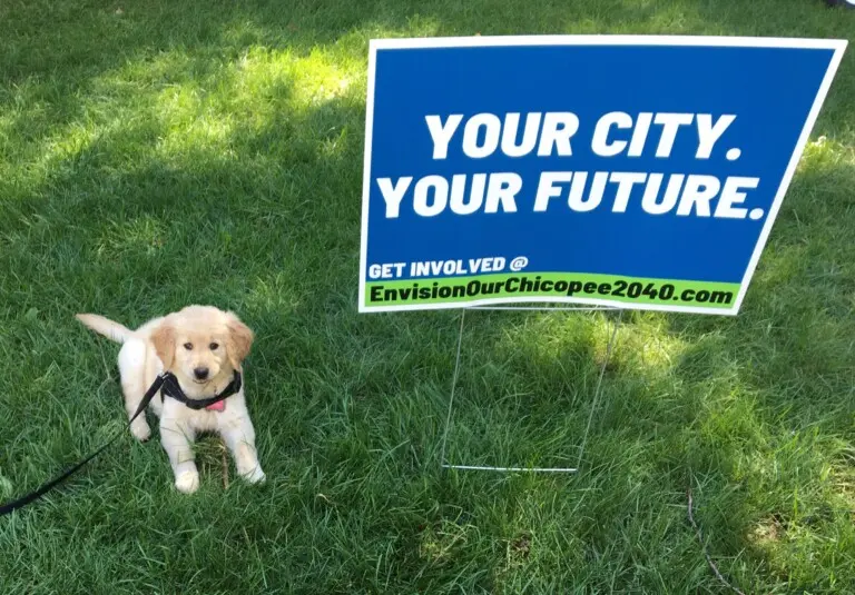 Puppy and yard sign