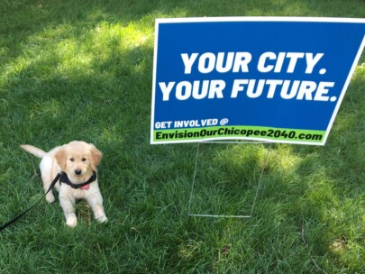 Puppy and yard sign